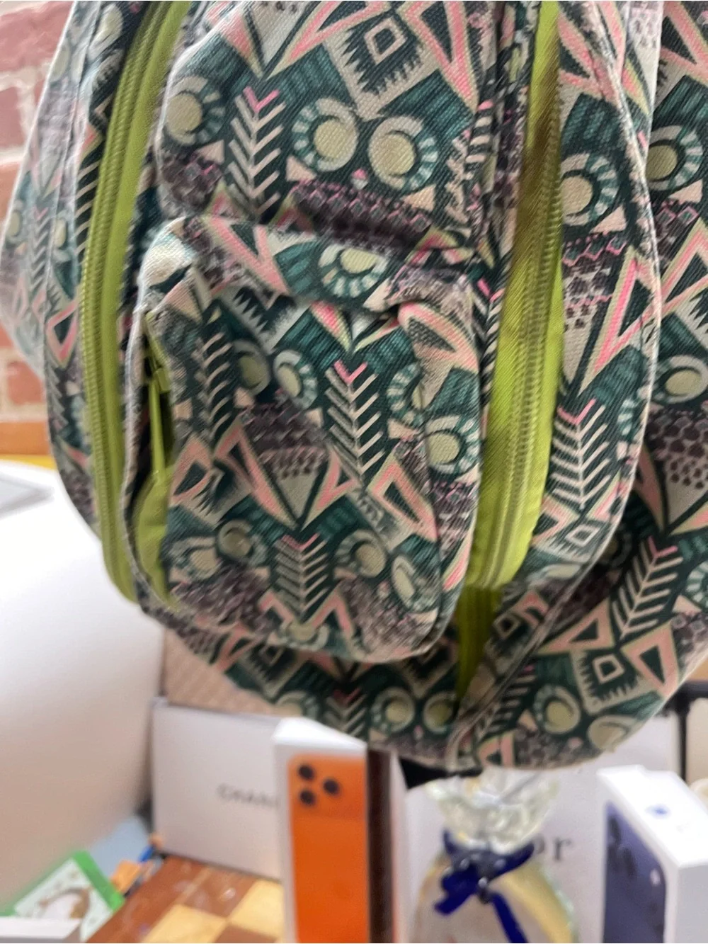 print KAVU Rope Bag featuring lime-green zippers and an owl motif accent.